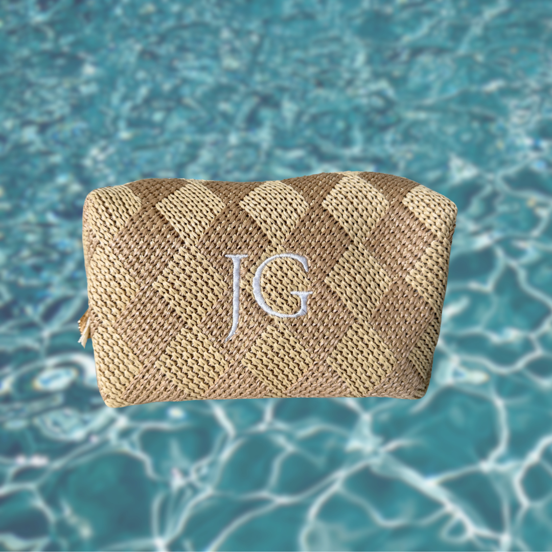 Woven pouch with 'JG' monogram on a blue water background